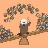 シーソーで大文字と小文字のブロックを入れ替えるラッコ