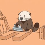 太い文字ブロックをアイロンで半分の幅に整えるラッコ