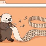 長いリボンから%のワッペンを剥がすラッコ